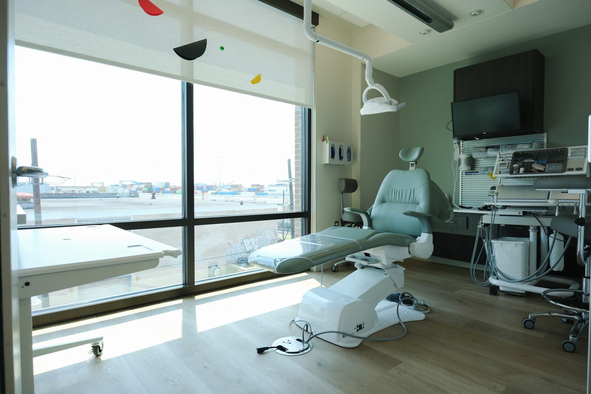 A treatment room at Camenzuli Dental Excellence overlooking Uptown New Orleans