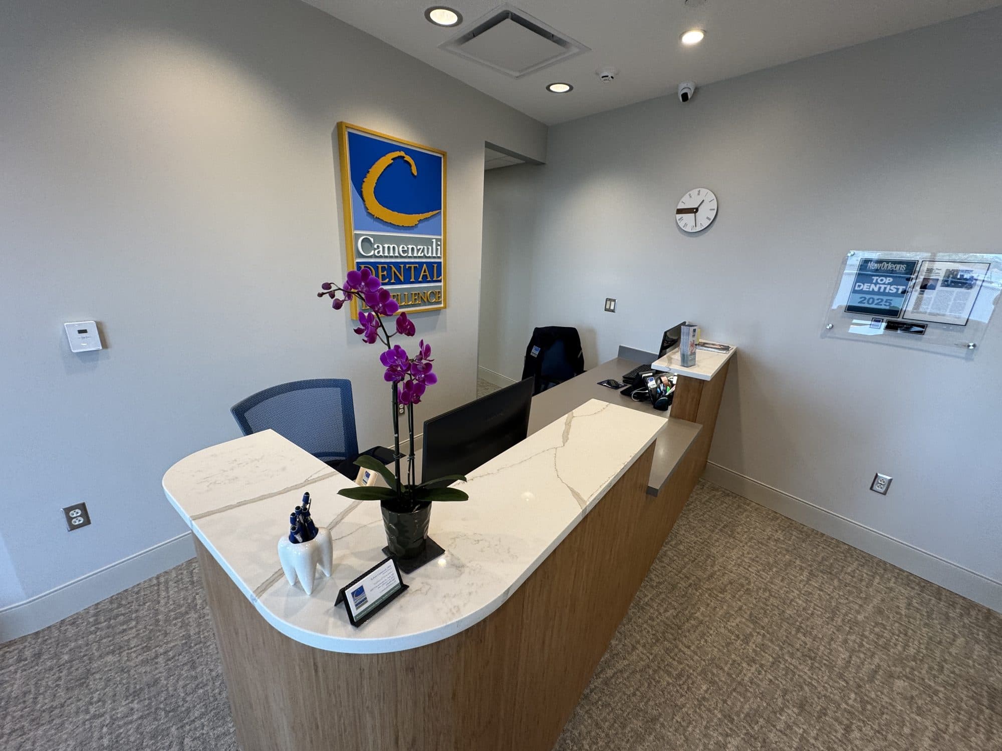 The marble reception desk at Camenzuli Dental Excellence, ready to welcome new patients